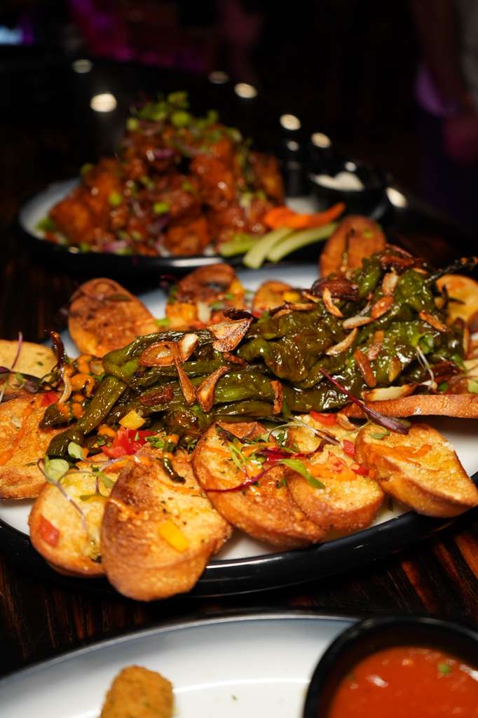 Blistered long hots with crostini and balsamic glaze